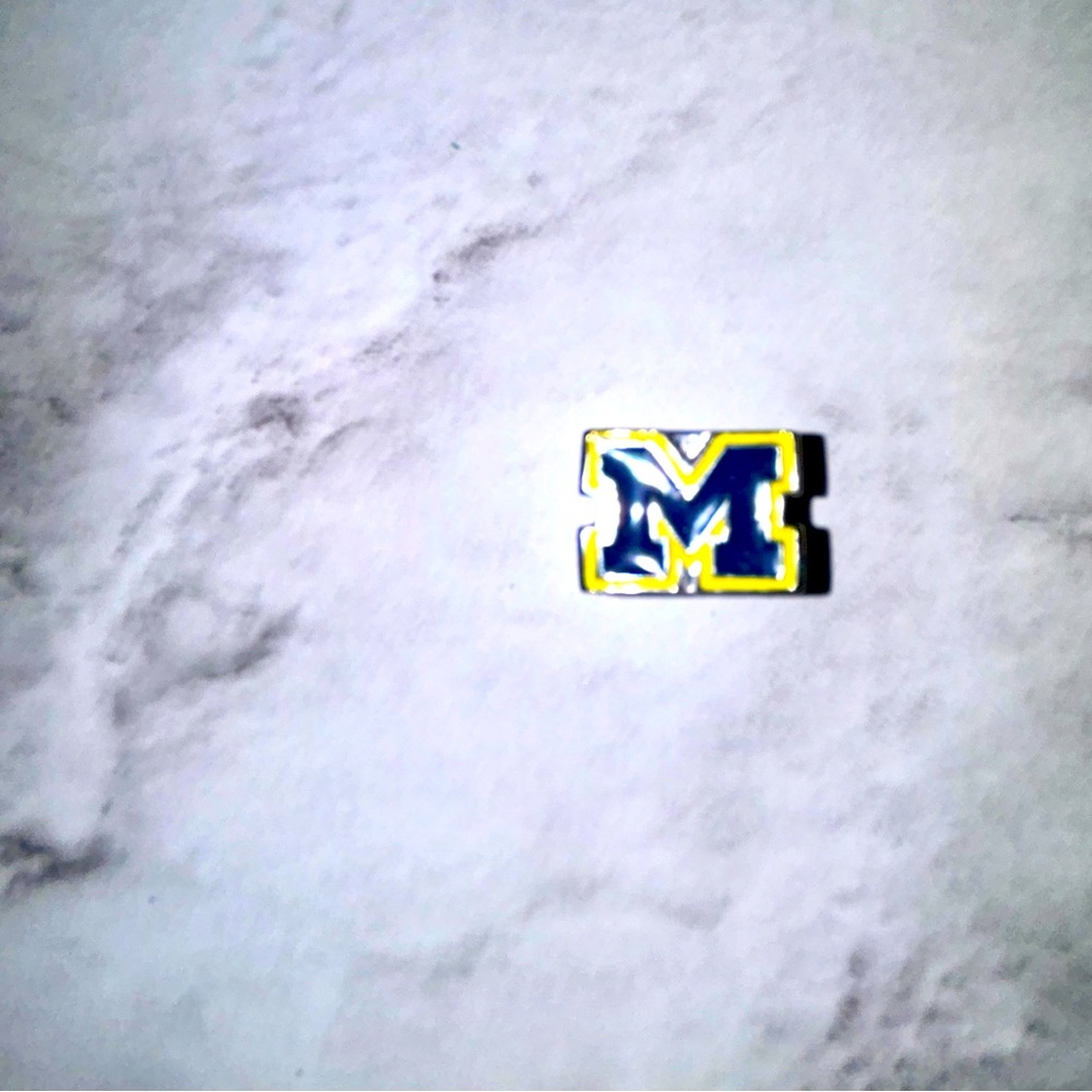 Pandora like charm. Not brand but will fit Pandora bracelets.